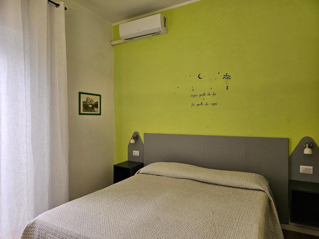 Postel nebo postele na pokoji v ubytování L'arancio B&B