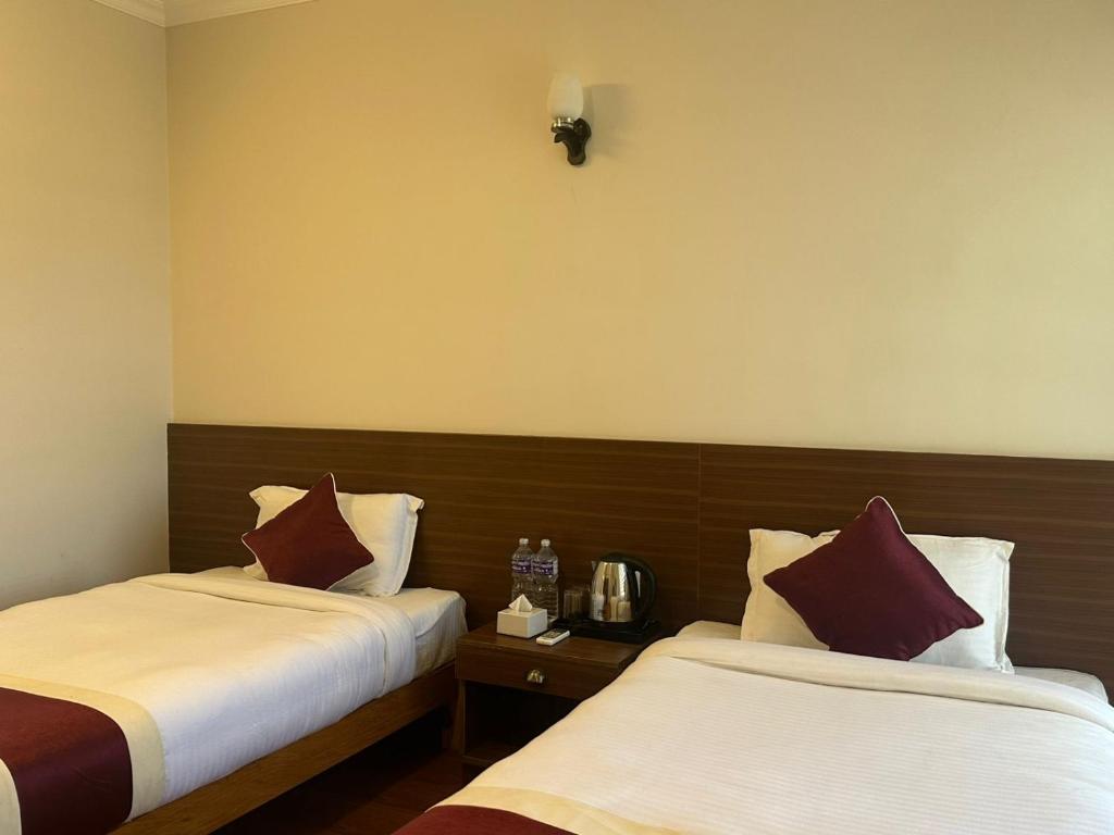 Postel nebo postele na pokoji v ubytování Hotel Sohum