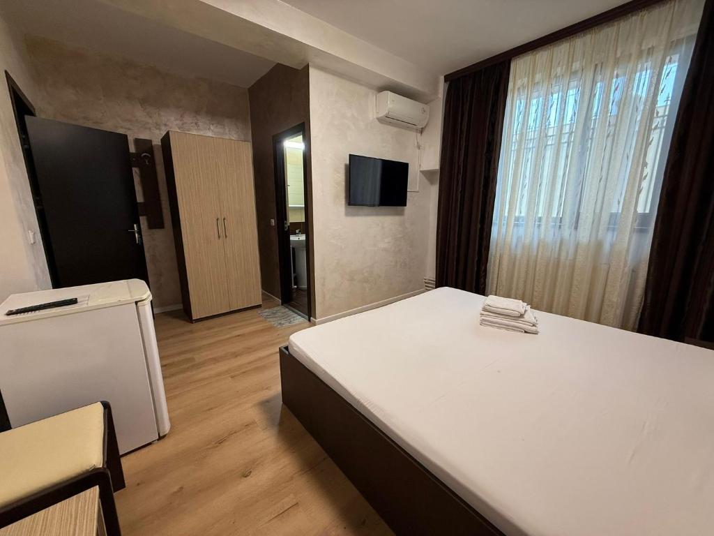 Postel nebo postele na pokoji v ubytování Villa George