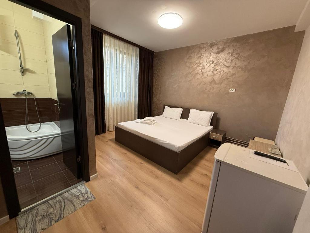 Postel nebo postele na pokoji v ubytování Villa George