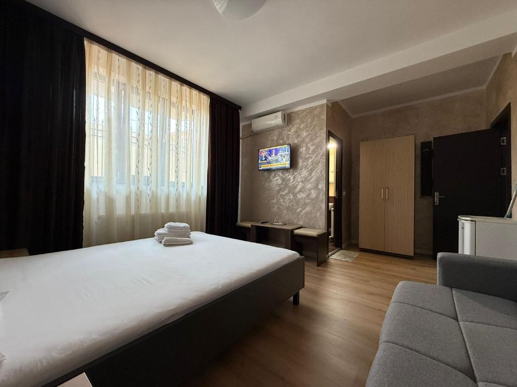 Postel nebo postele na pokoji v ubytování Villa George