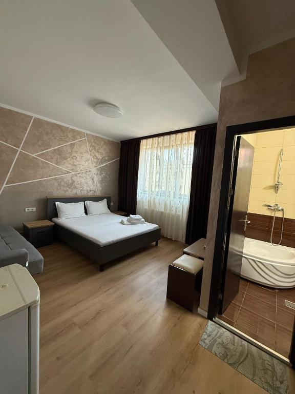 Postel nebo postele na pokoji v ubytování Villa George