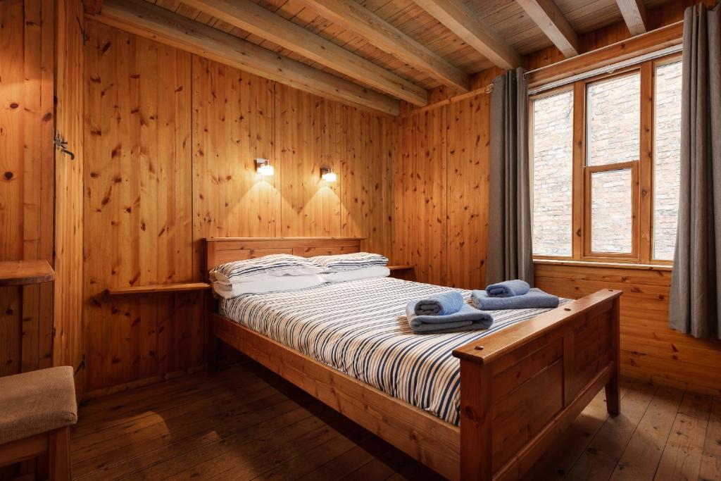 Postel nebo postele na pokoji v ubytování Discovery Cottage