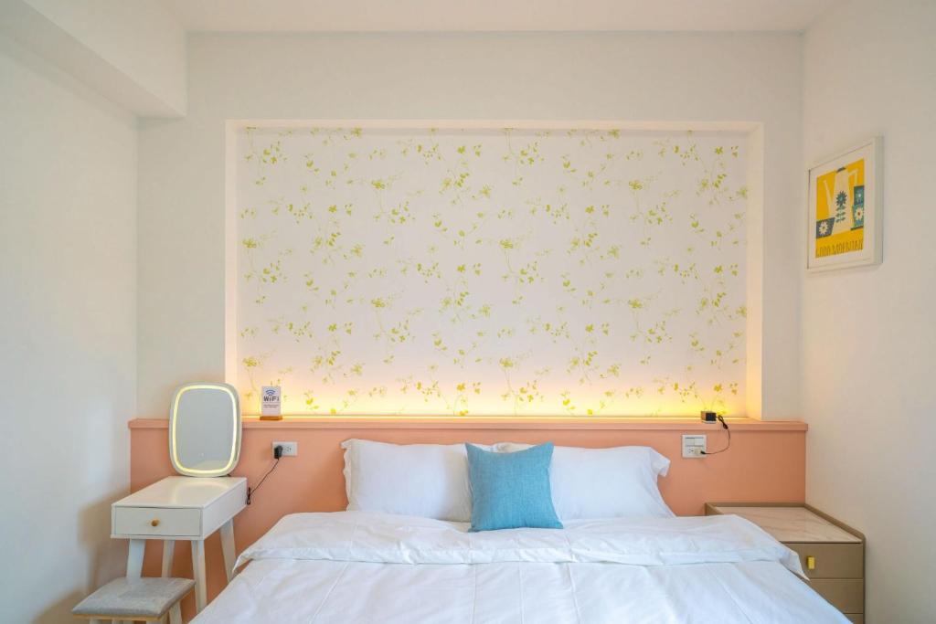 Postel nebo postele na pokoji v ubytování 十月 Mooon House