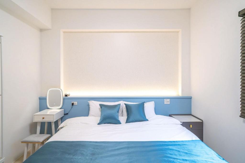 Postel nebo postele na pokoji v ubytování 十月 Mooon House