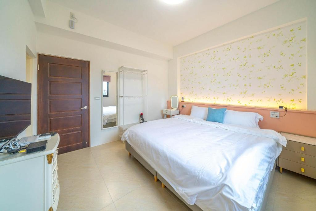 Postel nebo postele na pokoji v ubytování 十月 Mooon House
