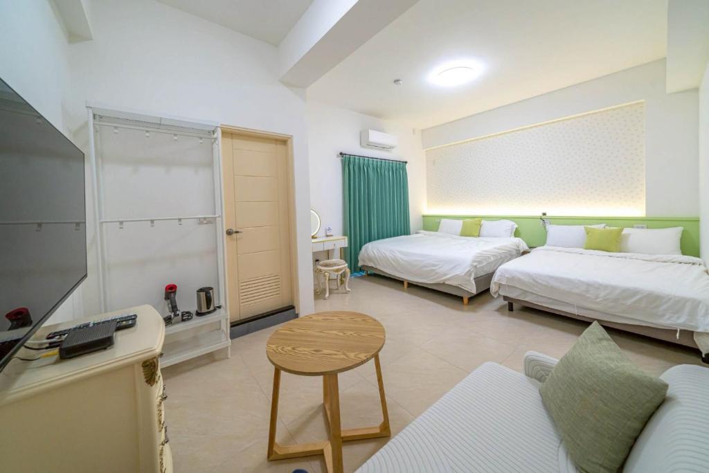 Postel nebo postele na pokoji v ubytování 十月 Mooon House