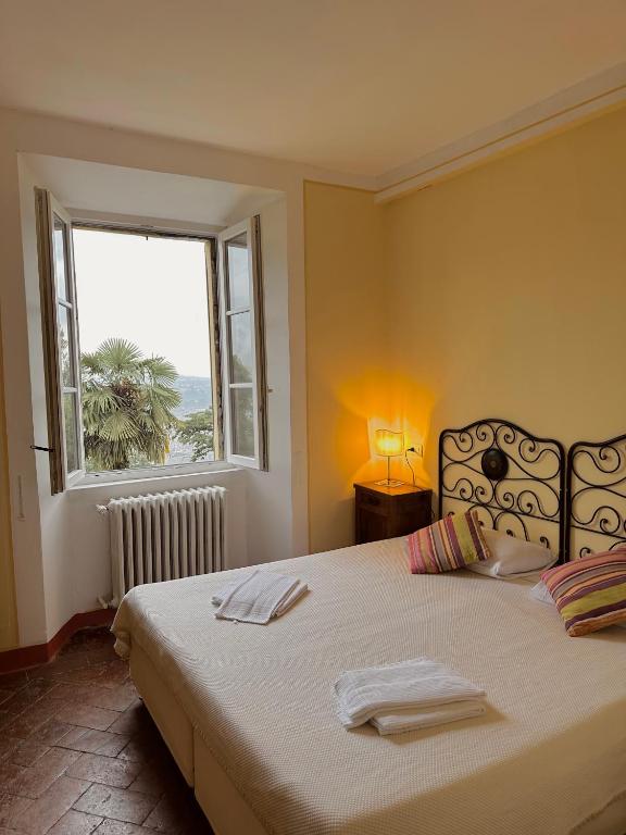 Posteľ alebo postele v izbe v ubytovaní Villa Corti Lakeview