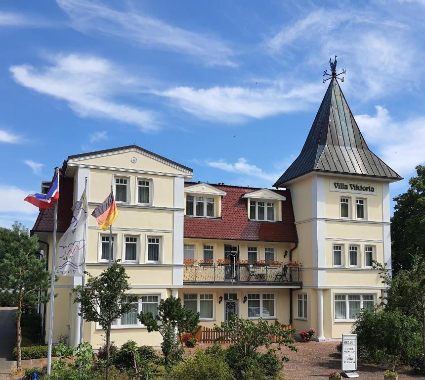 a large building with a spire on top of it at Villa Viktoria Whg 16 - "Auskuck" in Kölpinsee