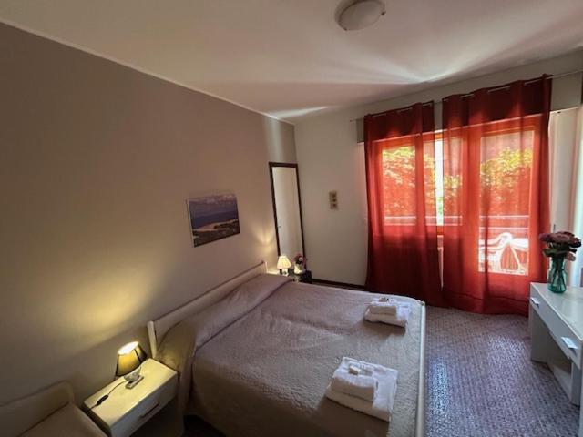 Postel nebo postele na pokoji v ubytování Hotel Gianna