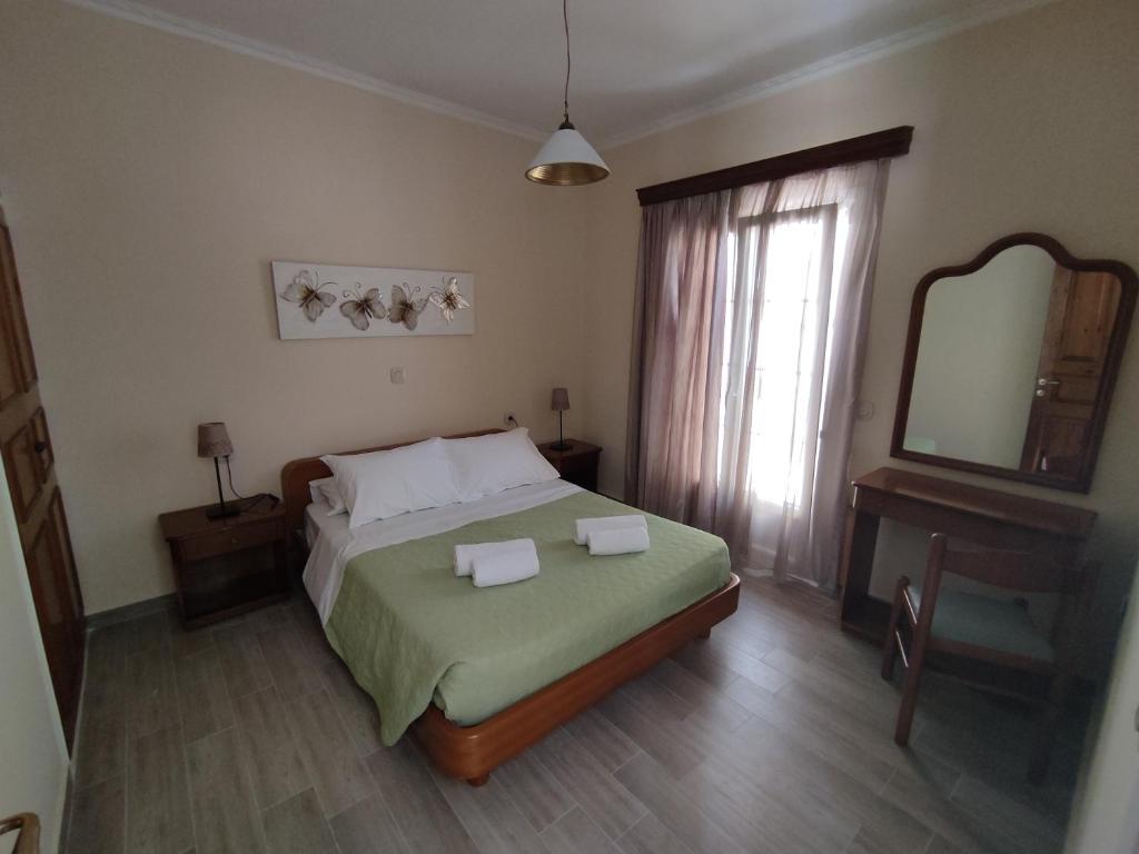 Postel nebo postele na pokoji v ubytování Alexandra Natalia Aparthotel