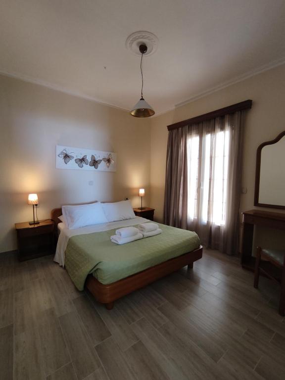 Postel nebo postele na pokoji v ubytování Alexandra Natalia Aparthotel