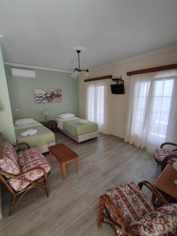 Postel nebo postele na pokoji v ubytování Alexandra Natalia Aparthotel