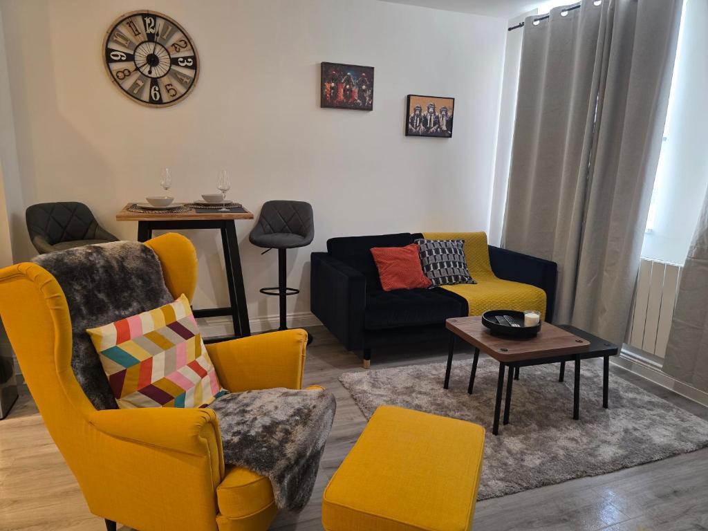 a living room with yellow chairs and a couch at Solihull 10 mins to NEC and Airport Free Parking in Solihull