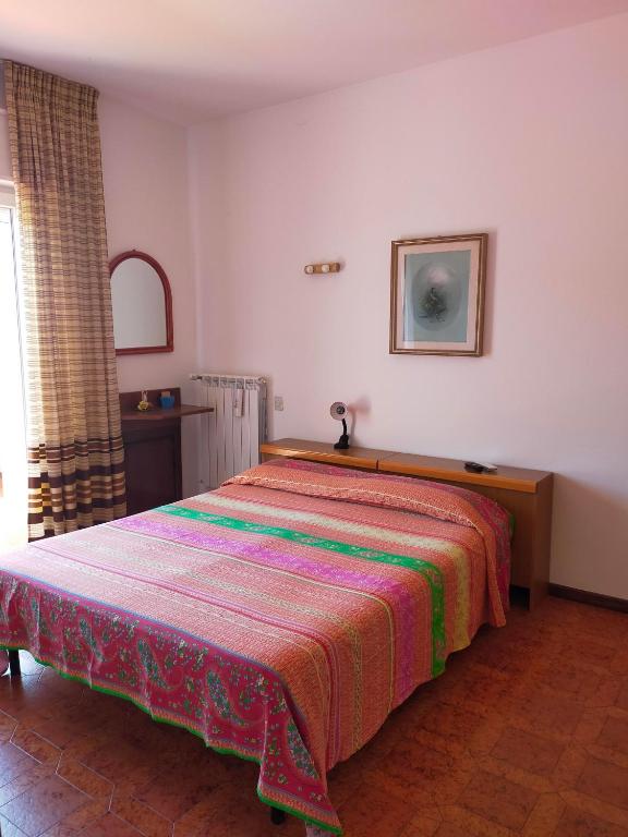 Postel nebo postele na pokoji v ubytování Cinzia House
