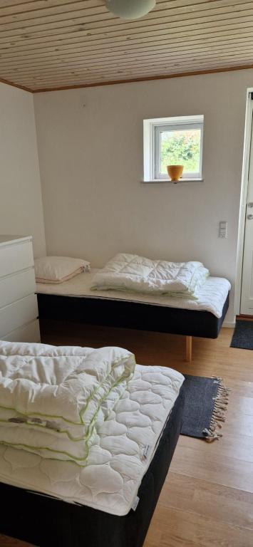 Postel nebo postele na pokoji v ubytování Grandgården