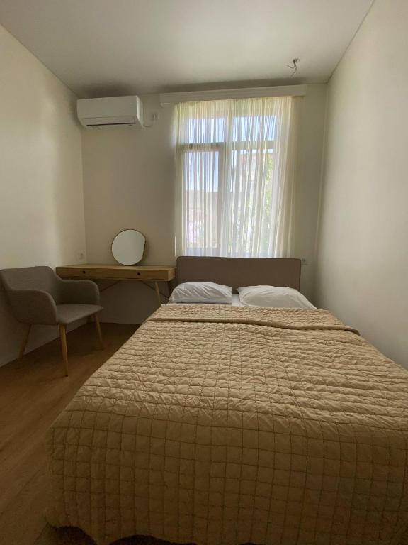 Postel nebo postele na pokoji v ubytování Middle city Guesthouse