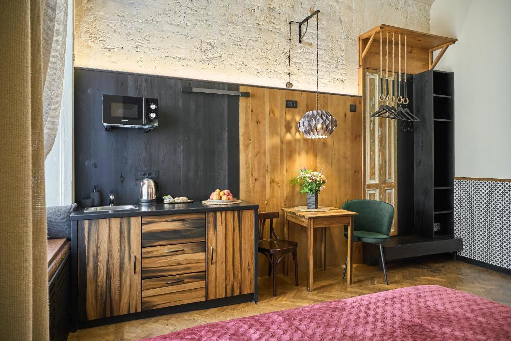 Kuchyň nebo kuchyňský kout v ubytování WOOD Design Aparthotel