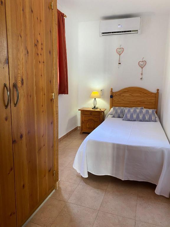 Postel nebo postele na pokoji v ubytování Casa Barca Cala Saona