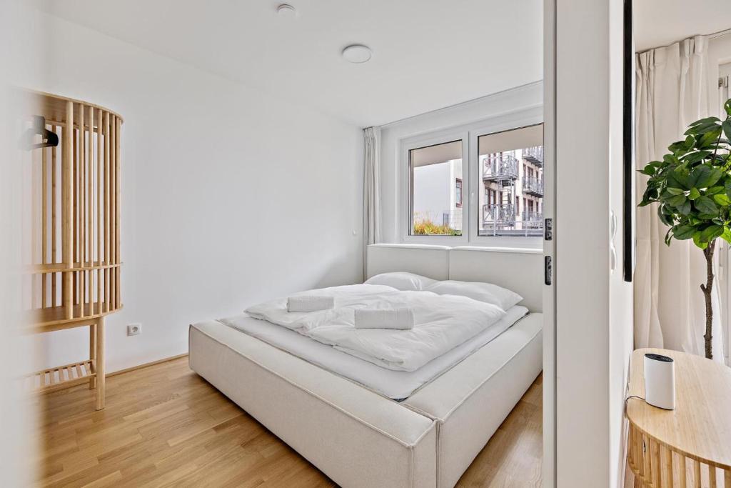 Ένα ή περισσότερα κρεβάτια σε δωμάτιο στο HIRSCH Apartments