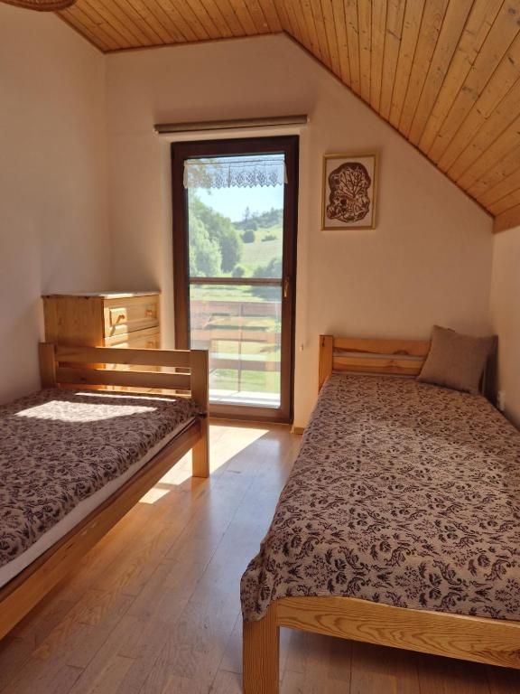 Postel nebo postele na pokoji v ubytování Chata Monika