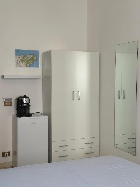 Postel nebo postele na pokoji v ubytování Affittacamere Casa Flora