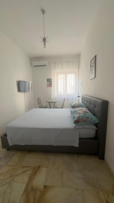 Postel nebo postele na pokoji v ubytování Affittacamere Casa Flora