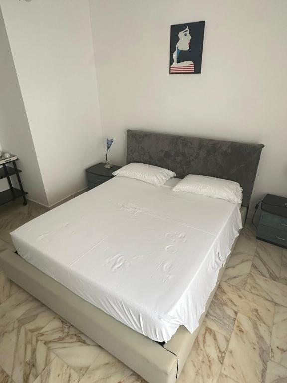 Postel nebo postele na pokoji v ubytování Affittacamere Casa Flora