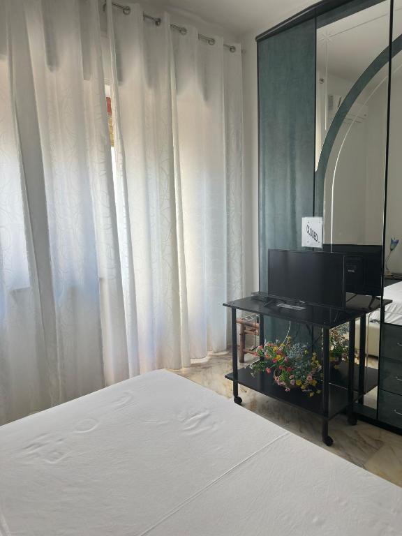 Postel nebo postele na pokoji v ubytování Affittacamere Casa Flora