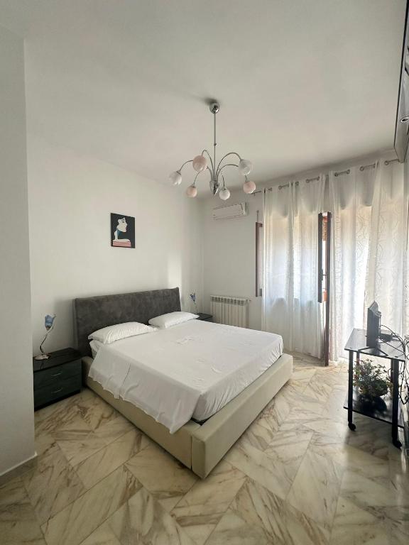Postel nebo postele na pokoji v ubytování Affittacamere Casa Flora