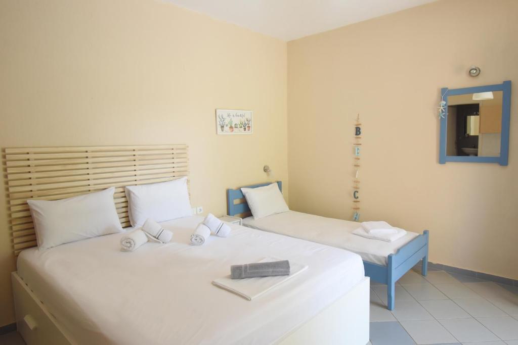 Postel nebo postele na pokoji v ubytování Hotel Argilos