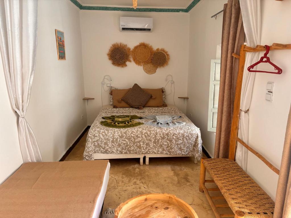 Postel nebo postele na pokoji v ubytování Riad Sanwa