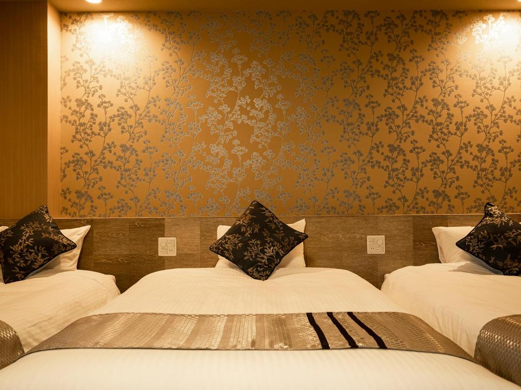 Postel nebo postele na pokoji v ubytování Hotel AreaOne Izumo