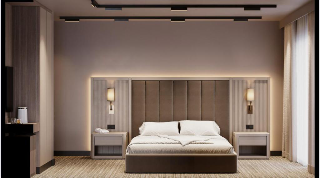 Postel nebo postele na pokoji v ubytování Max Suite Hotel