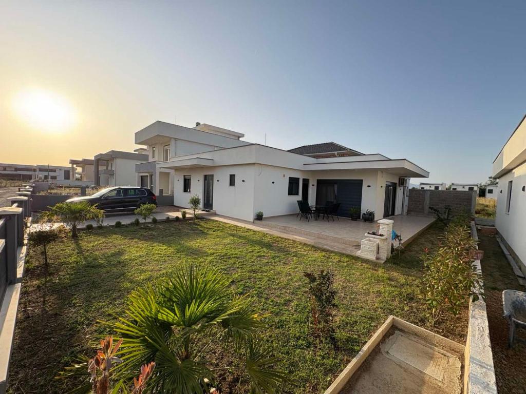 a view of a house with a yard at Villa Sunset in Donji Štoj
