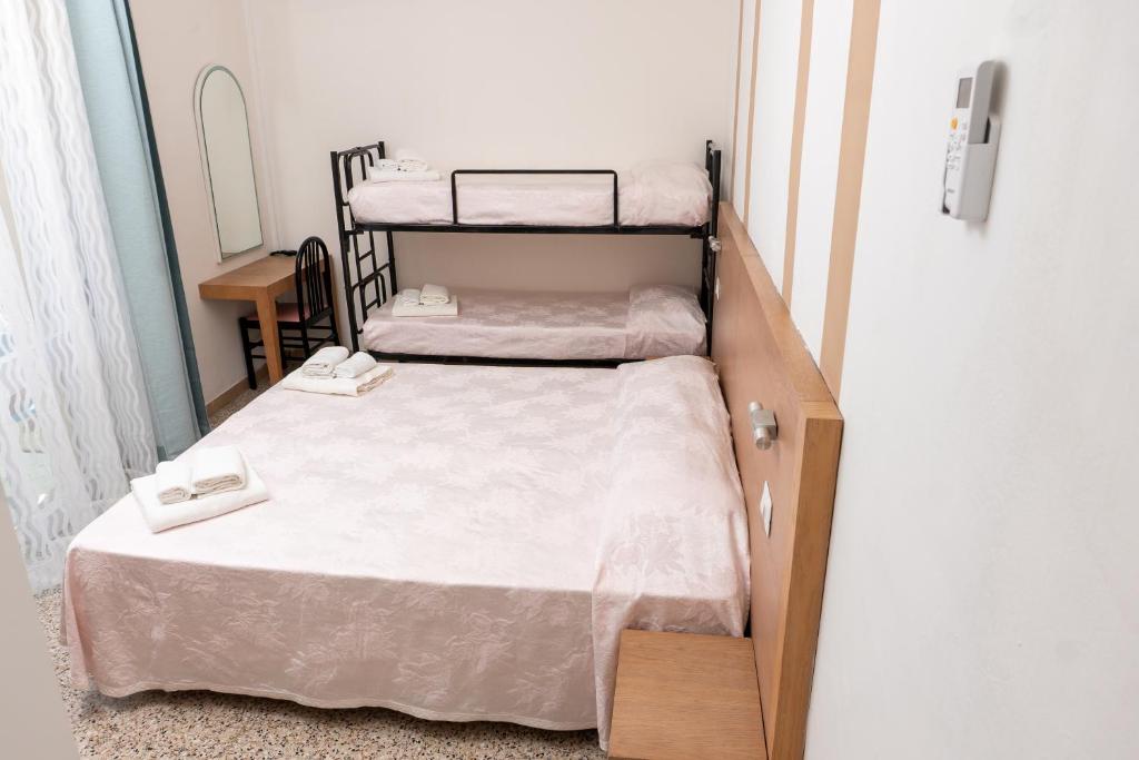 Postel nebo postele na pokoji v ubytování Hotel Gin sul mare