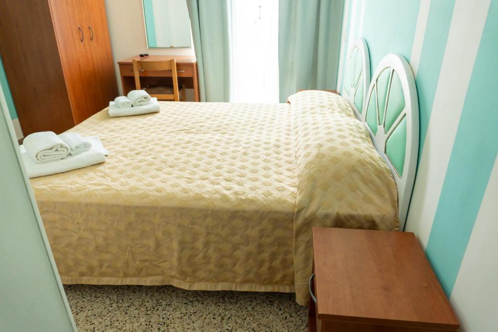 Postel nebo postele na pokoji v ubytování Hotel Gin sul mare