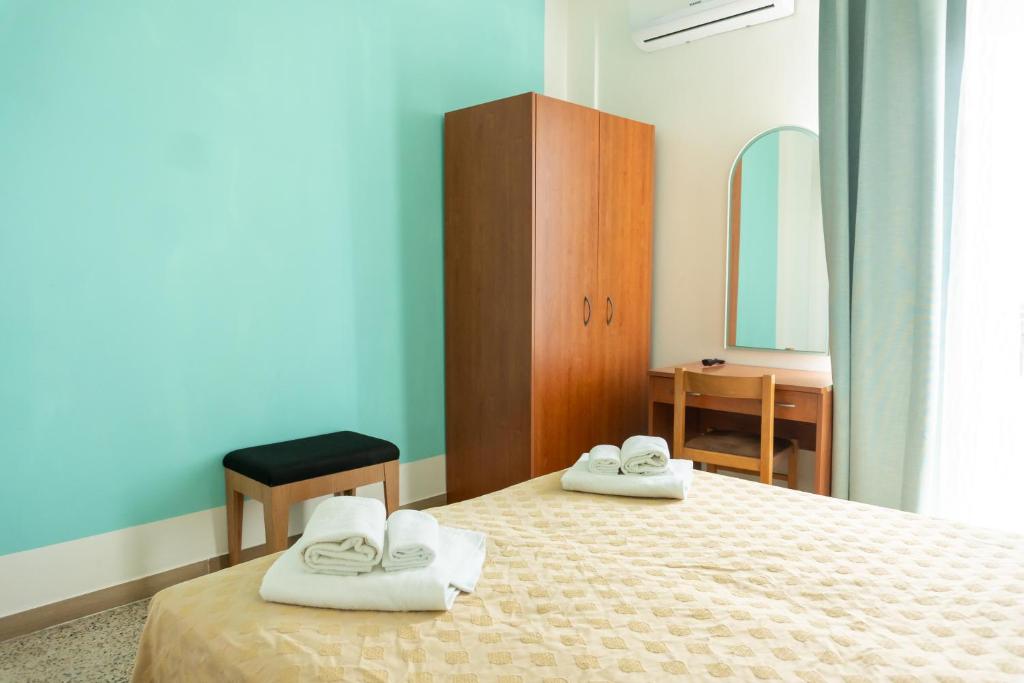 Postel nebo postele na pokoji v ubytování Hotel Gin sul mare