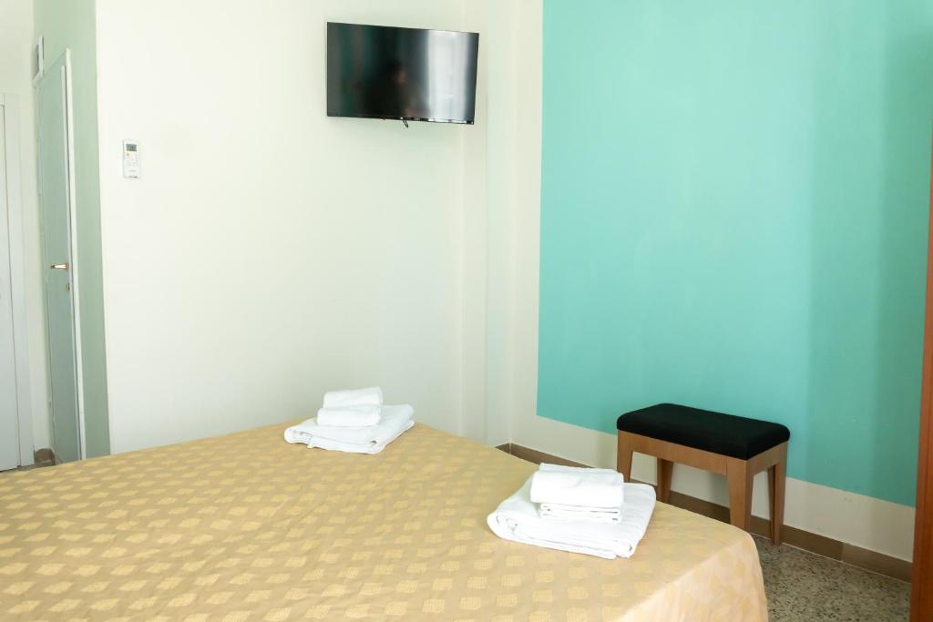 Postel nebo postele na pokoji v ubytování Hotel Gin sul mare
