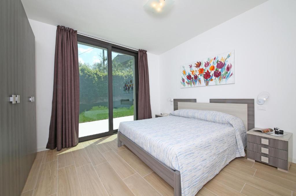 Łóżko lub łóżka w pokoju w obiekcie Villa T14
