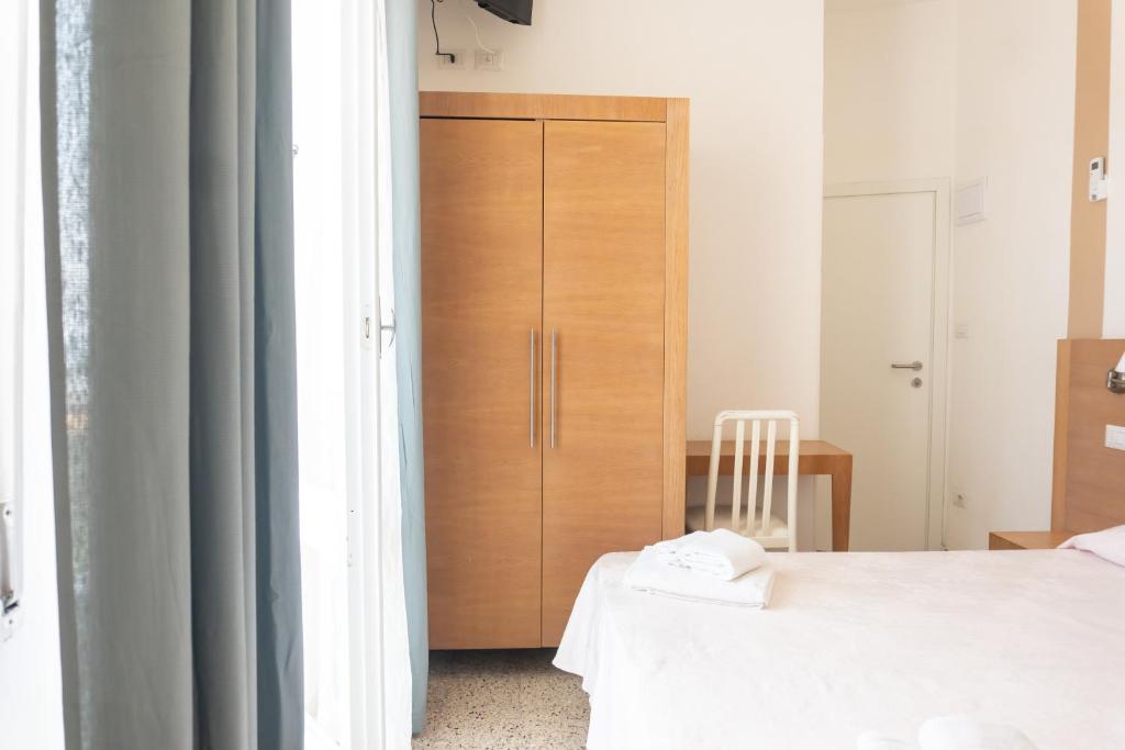 Postel nebo postele na pokoji v ubytování Hotel Gin sul mare
