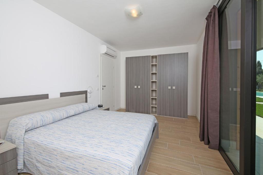 Łóżko lub łóżka w pokoju w obiekcie Villa T14