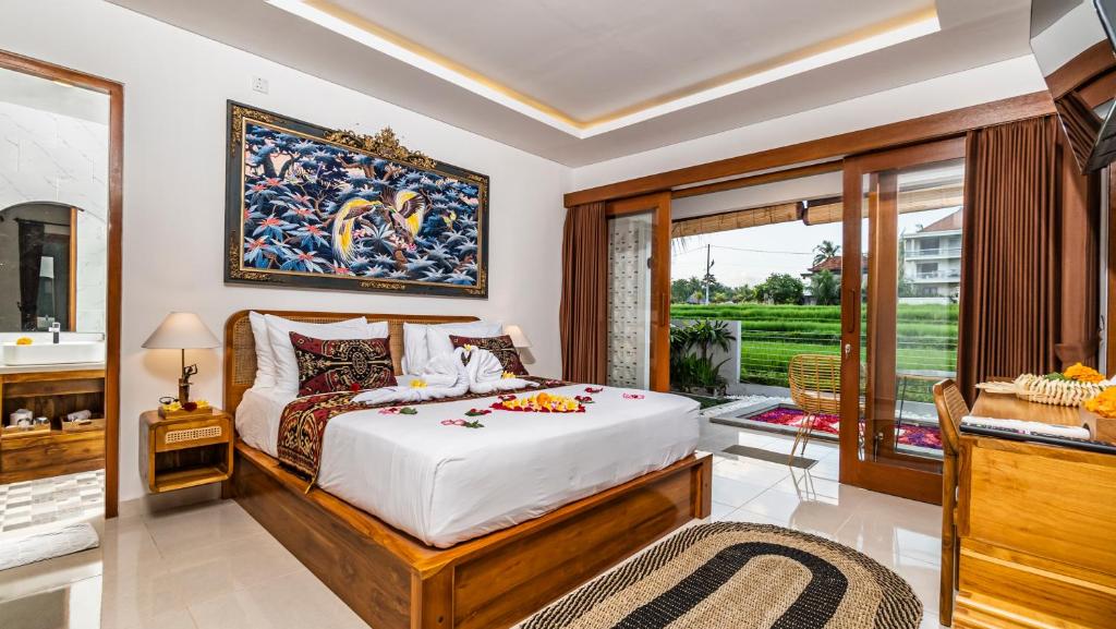 Postel nebo postele na pokoji v ubytování Putih DCarik Ubud