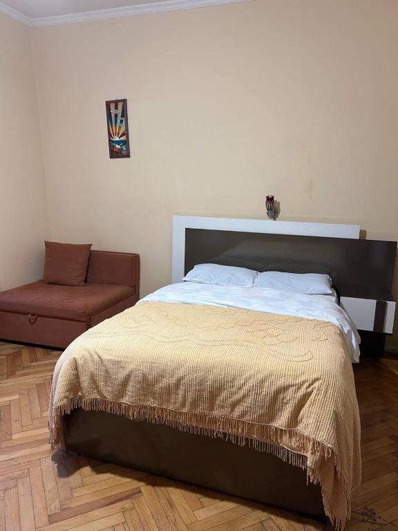 Postel nebo postele na pokoji v ubytování Sunny Tiflisi