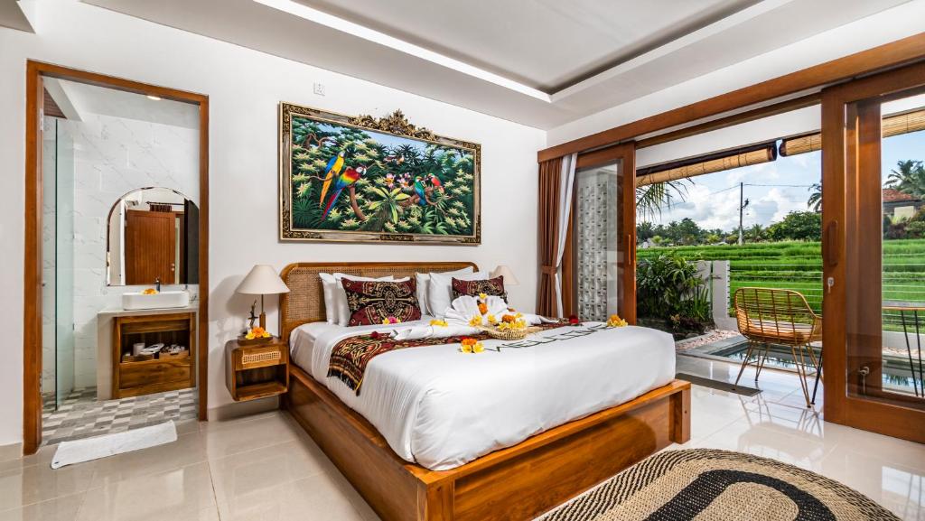 Postel nebo postele na pokoji v ubytování Putih DCarik Ubud