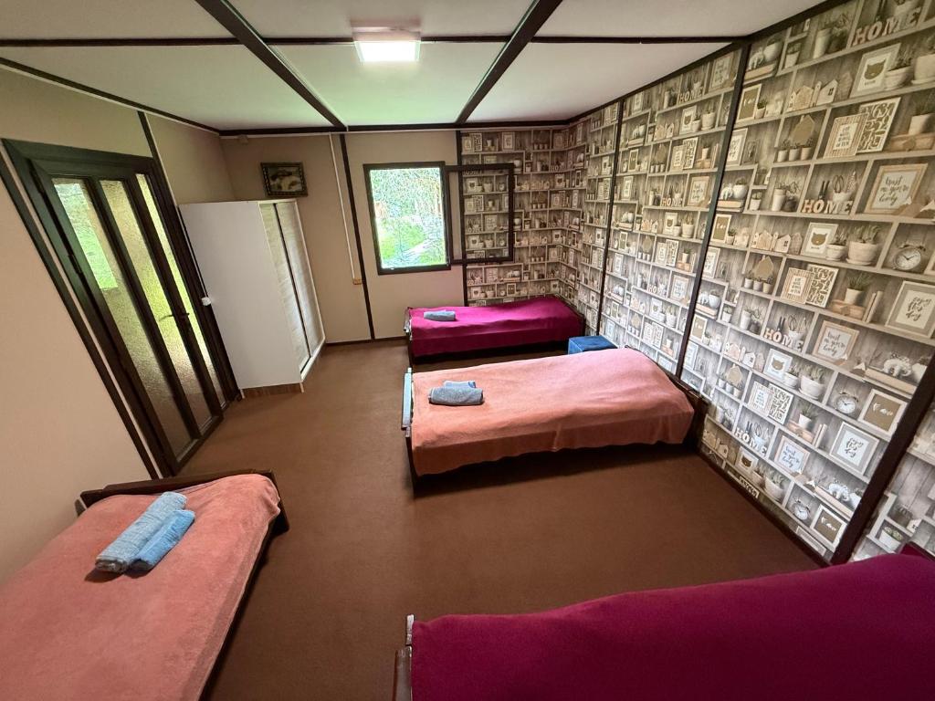 Postel nebo postele na pokoji v ubytování Lore Adventure