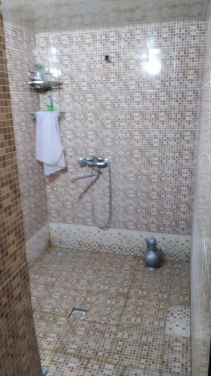 Ένα μπάνιο στο Begmurod guesthouse
