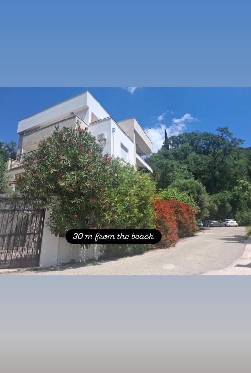a house with a sign that says so im from the beach at Apartments Villa Simonovic in Petrovac na Moru