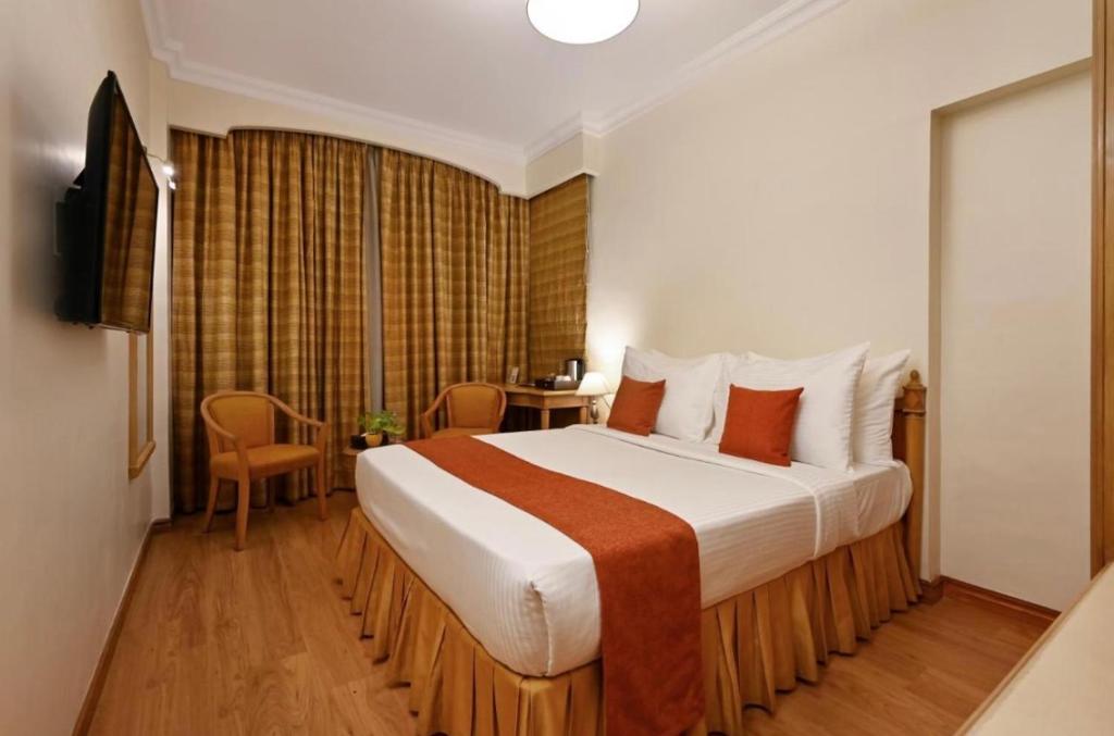 Postel nebo postele na pokoji v ubytování Hotel Diamond Inn-Near IGI -Airport-Terminal-3