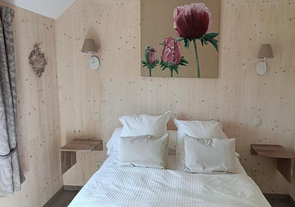 Postel nebo postele na pokoji v ubytování La clef des bois